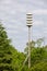 Emergency Siren Tower Alerting Tornado Warning in Rural Area