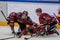 Emils Gegeris L and Nerijus Alisauskas R, helps to their injured teammate Mikelis Redlihs C, who is lying on ice