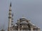 Eminonu Mosque, also known as New Mosque, or Yeni Cami, in Istanbul, Turkey, covered in snow during a winter afternoon.