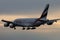 Emirates A380 plane flying up in the sky, dusk