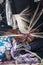 Emirati woman is weaving traditional basket from palm leaves, slow shutter speed to show the motion