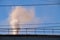 Emission of harmful vapors into the atmosphere from a plant in ukraine in the city of dnipro on the background of the sky