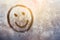 Emoji smile, Autumn rain, inscription on sweaty glass smiley with copy space for text