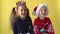 Emotion Cute Happy Cheerful 2 Siblings Friends Baby Girl And Boy in Santa Suit Applaud Laughing Looking On Camera At