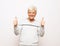 Emotion, lifestyle and old people concept: Portrait of energetic positive old man show okay sign