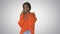 Emotional african american woman in bright jumper talking on the