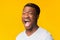 Emotional Afro Man Screaming Standing Over Yellow Background, Studio Shot