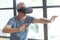 Emotional aged man using VR glasses