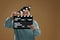 Emotional asian actor with clapperboard on brown background, space for text. Film industry