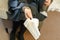 Emotional beautiful young psychologist woman holding a napkin for a client