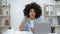 Emotional Black Teacher Guy At Laptop Explaining Lesson Online Indoors