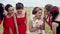 Emotional bride and bridesmaids talking and laughing. Slow motion.