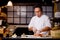 Emotional chef humming the song while preparing sushi