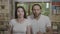 Emotional facial expression of young teenage couple showing shock feeling confused and stunned -