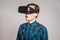 Emotional funny man wearing virtual reality goggles.