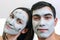 Emotional large portrait of a married couple in masks for the face of clay. day Spa, Wellness, skincare