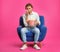 Emotional man with popcorn sitting in armchair during cinema show