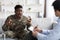 Emotional military black man gesturing while talking to psychotherapist