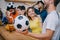 emotional multicultural group of friends watching soccer match