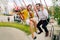 Emotional newlyweds screaming while riding on high carousel in amusement park. Expressive wedding couple at carnival.