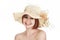 Emotional portrait of a naked girl and hat on white background.