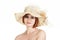 Emotional portrait of a naked girl and hat on white background.