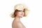 Emotional portrait of a naked girl and hat on white background.