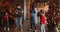 Emotional positive family dancing together in decorated living room.