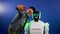 Emotional robot posing for selfie of cheerful man
