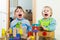 Emotional sibling playing in blocks in home