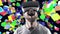 Emotional smile happy man wearing virtual reality goggles. VR headset. Within virtual space cubes black look up