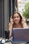 emotional student girl having cup of coffee outside, waiting for exam results