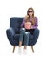 Emotional teenage girl with 3D glasses and popcorn sitting in armchair during cinema show