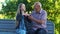 Emotional teenage granddaughter tells story to old man