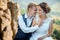 Emotional wedding portrait. Beautiful young newlywed couple is pretty smiling, tenderly holding hands and rubbing noses