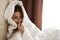 emotional woman hid under blanket in bed near window mobile phone interior curtains