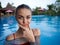 emotional woman in swimsuit in the pool luxury leisure swimming