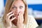 Emotionally confused woman talking on phone closeup