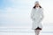 Emotive portrait of fashionable model in white coat and beret