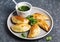 Empanadas with chimichurri sauce. Traditional Latin American cuisine