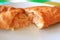 Empanadas de Camarones or Chilean Stuffed Pastry Filled with Shrimps and Cheese Cut in Half on White Plate