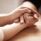 Empathy, support and spiritual with people holding hands in comfort, care or to console each other. Trust, help or love