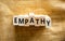 Empathy symbol. The concept word Empathy on wooden blocks. Beautiful canvas background, copy space. Business, psychological and