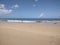Empiral Crane on Playa Espinar Beach Aguada Puerto Rico sand trees island life clouds blue sky