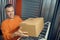 Employee arranging boxed items on the shelving unit