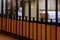 Employee of an Asian restaurant, making dumplings, viewed through the open kitchen in a shopping mall