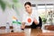 Employee of delegation prepares negotiating table - sets up flag of India and Japan