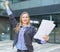 Employee glad woman standing with paper documents