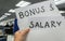 Employee is happy after yearly bonus and new salary