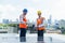 An employee listening to a description of the Solar Panel`s operation. Foreman and Worker maintaining solar energy panel